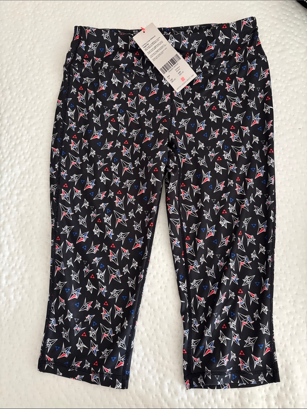 Sweaty Betty Black Capri Leggings with Red, White & Blue Star Geometric Print